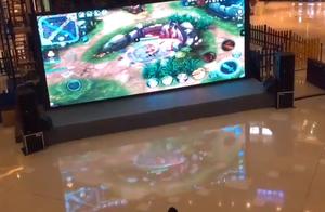 The staff member is hit with the huge screen in ba