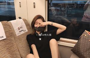 The net steps on a seat to take a picture on train