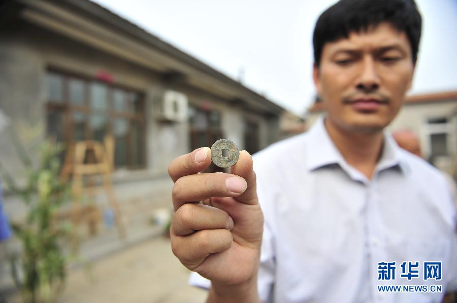韩媒：韩国坟墓中大量出土中国2000年前铜钱