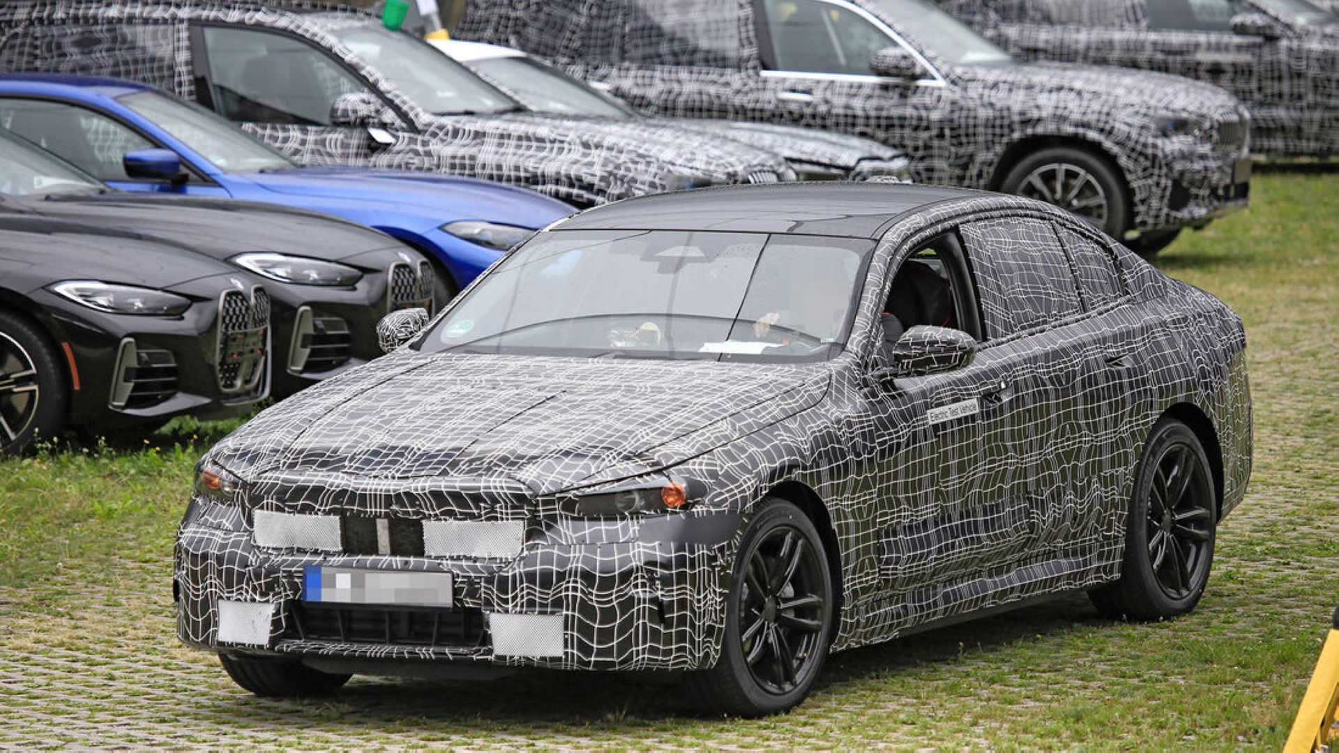 BMW i5 road test spy photos exposed top with 750 horsepower iMedia