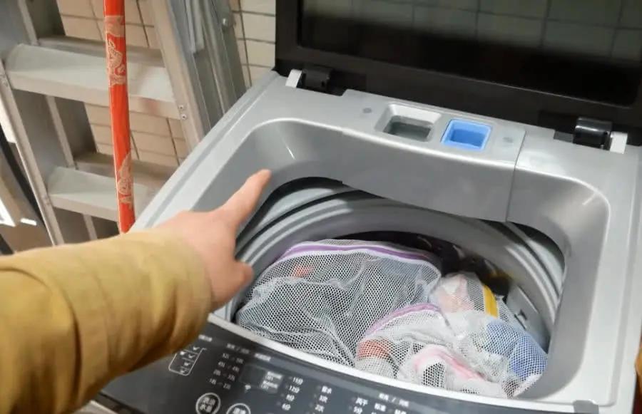 What should I do if my clothes are stained with lint after washing