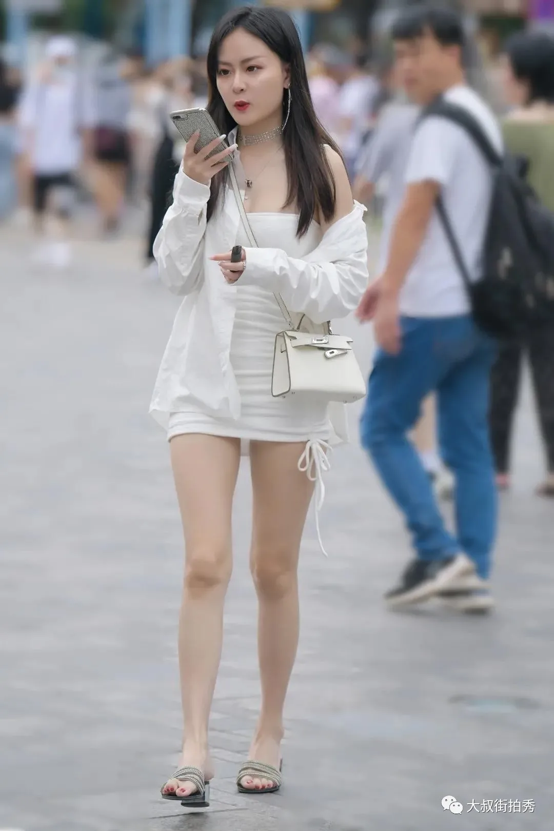 Fashion girl with long legs wearing white shirt and short skirt - iMedia