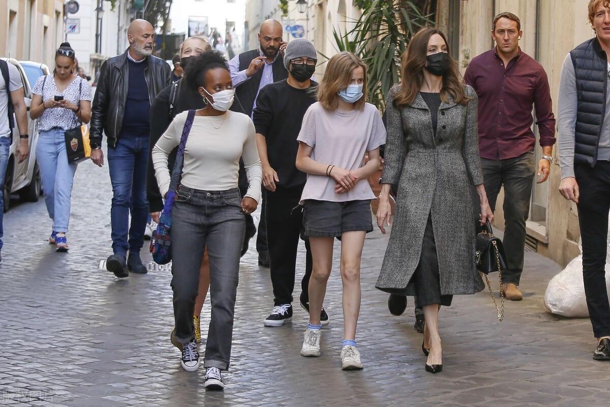 Angelina Jolie Walks Streets of Rome in Breezy White Ensemble
