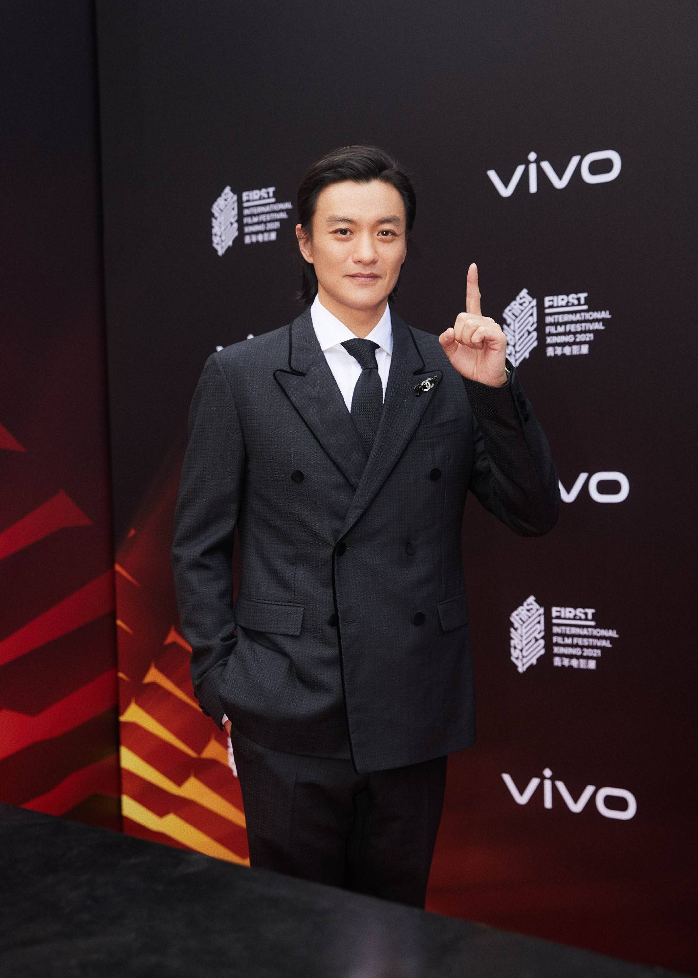 Actor Zhou Yiwei poses on the red carpet of 2018 Vogue Film Gala on News  Photo - Getty Images