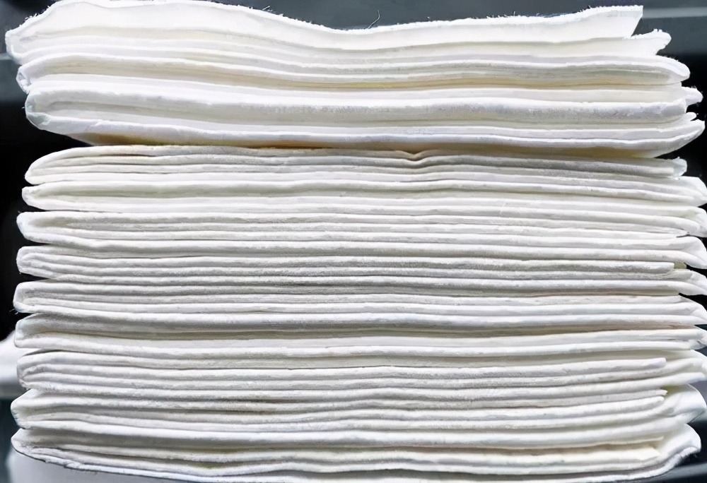 What is the thickness of A4 paper after it is folded 100 times in half