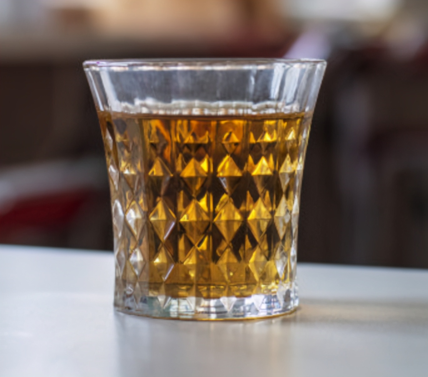 What does it mean to knock on the table three times when serving tea to