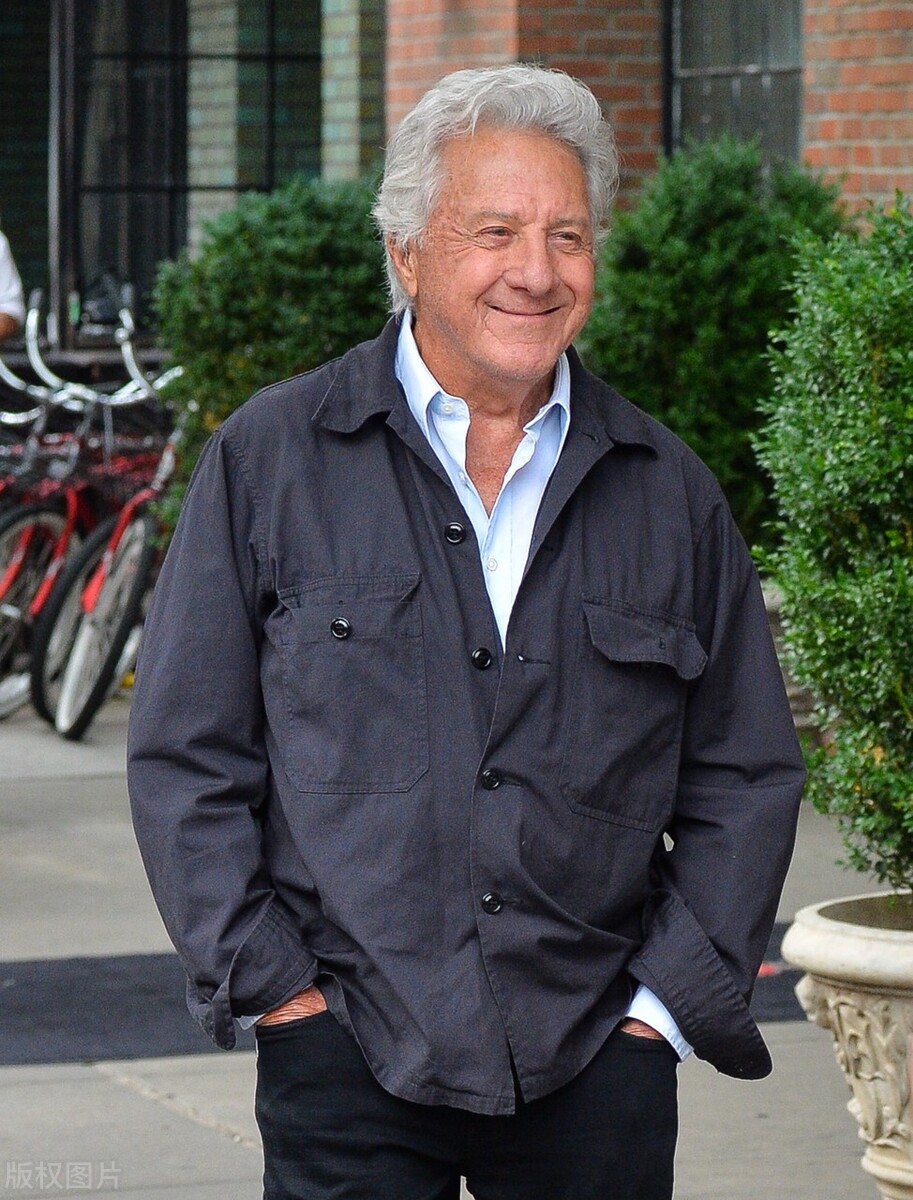 Dustin Hoffman and his son are walking on the street. The father and