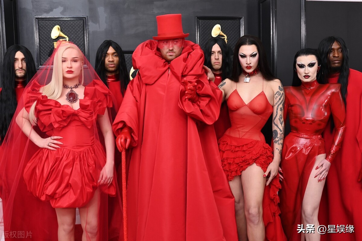 Sam Smith is wearing a red tutu skirt + top hat with beautiful eyes iNEWS