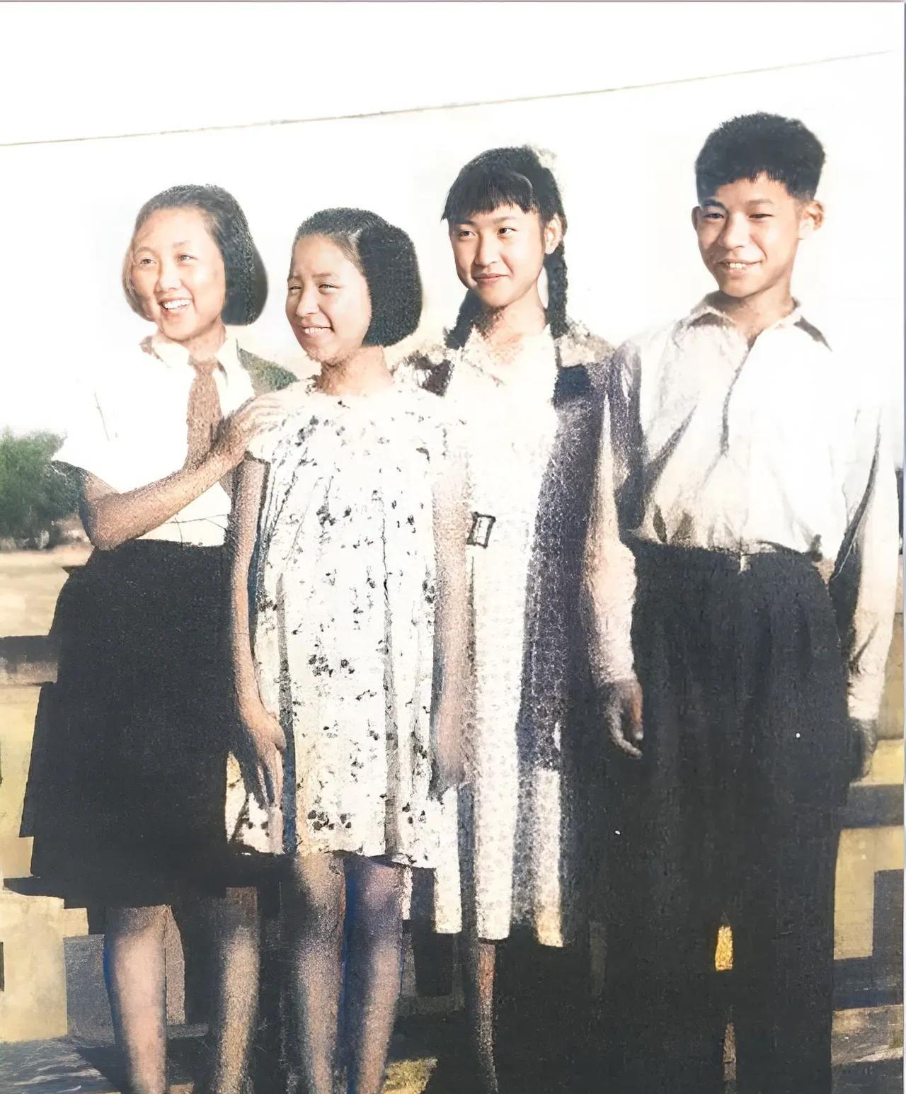 In the group photo of the three 