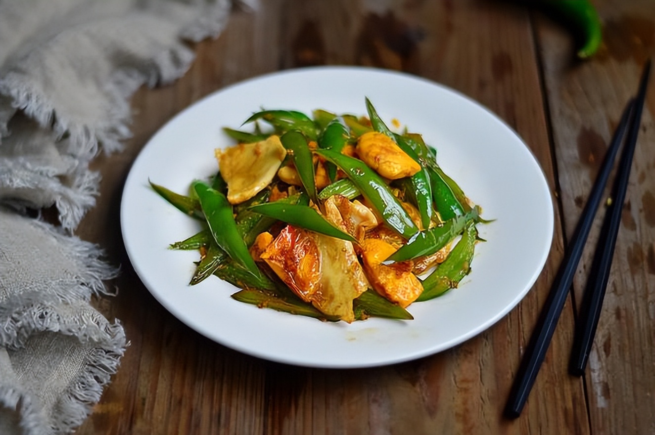 Poached Eggs with StirFried Peppers is a traditional dish. Here is a recipe. The sauce is