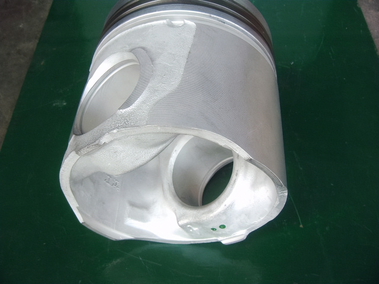 The gap between the piston and the cylinder wall is too large, causing