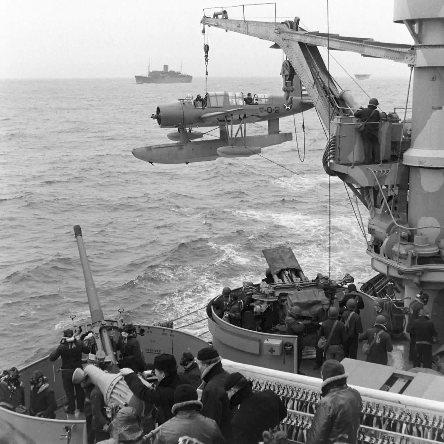 The battleship USS New York hoisting a Waterplane during a North ...