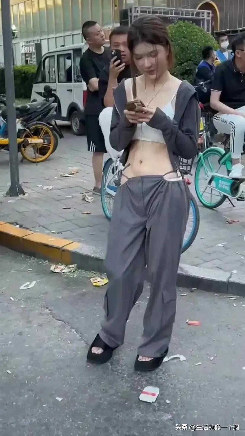 The scene of a beautiful girl wearing crotchless pants, showing her