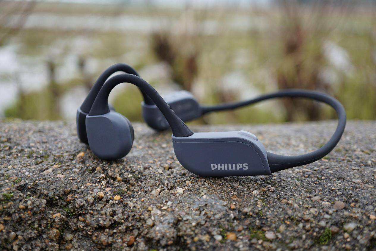 What are the advantages and disadvantages of open earphones? List