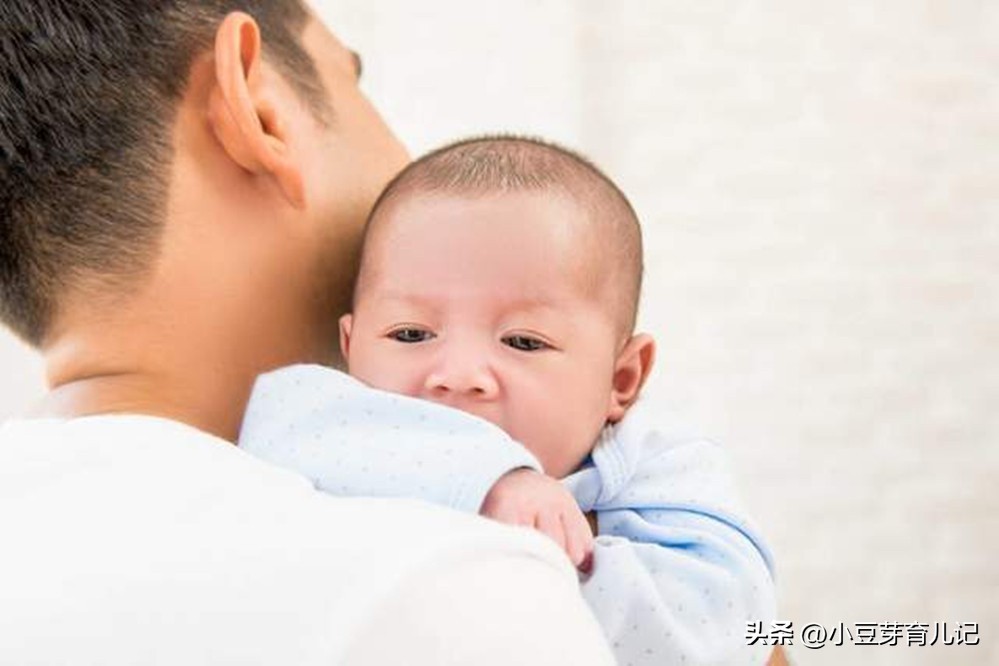 The baby likes to be hugged vertically, but the mother "pleases" but is