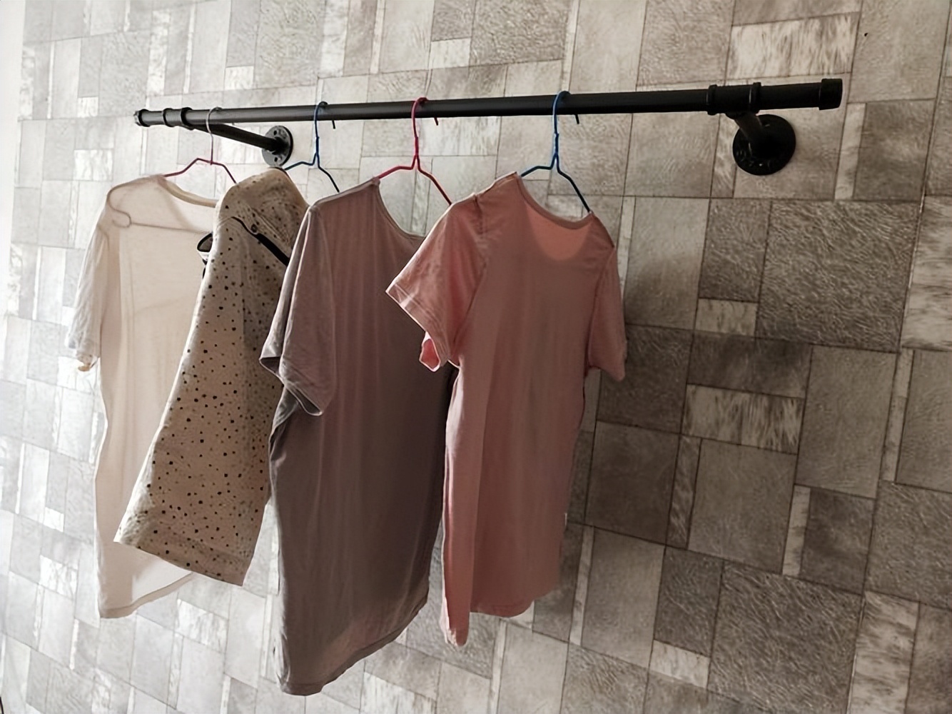 Don't throw away the old clothes hangers, fold them in half and put