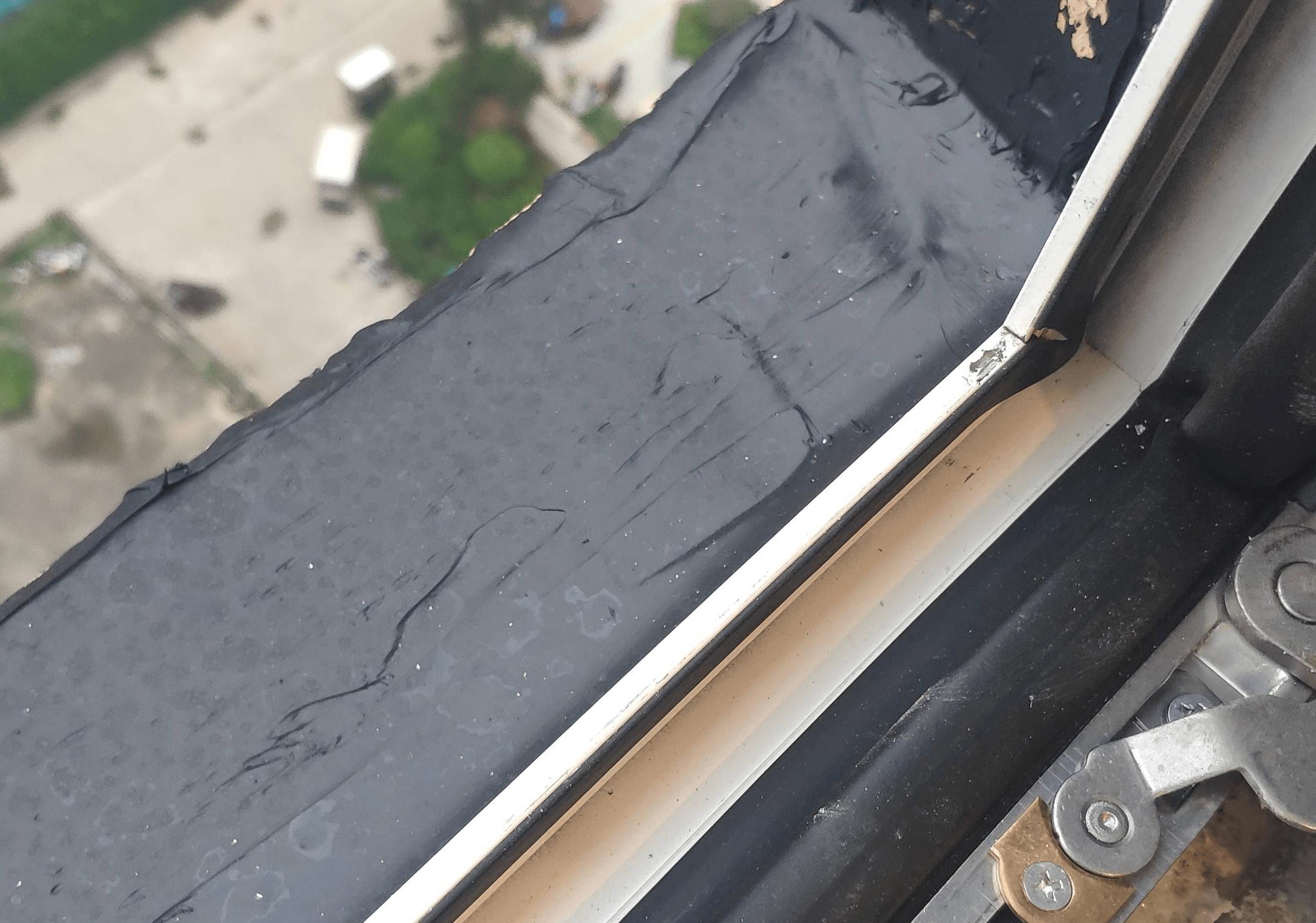 What is the cause of water seepage on the wall under the window sill