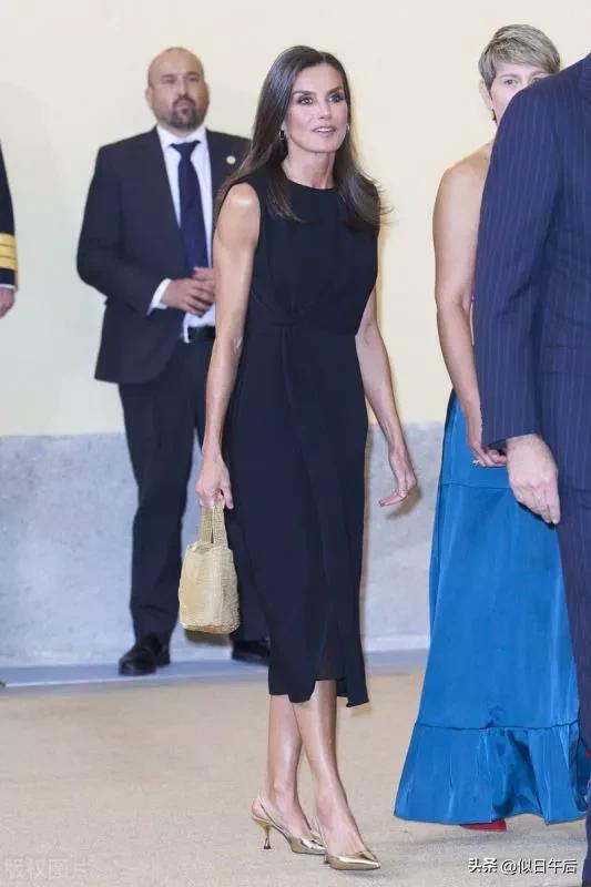 Queen Letizia of Spain wears a black sleeveless dress + golden high