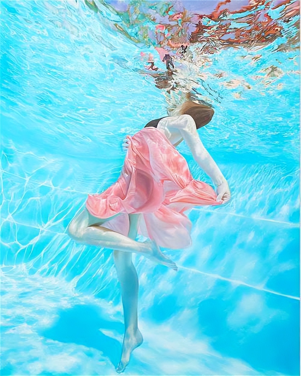The body painting in the water, the dress is wrapped around the body