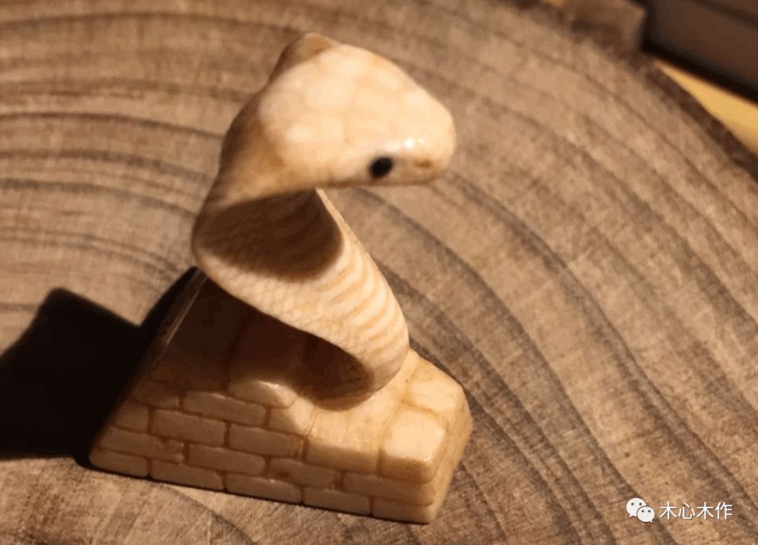 Wood carving snake iNEWS