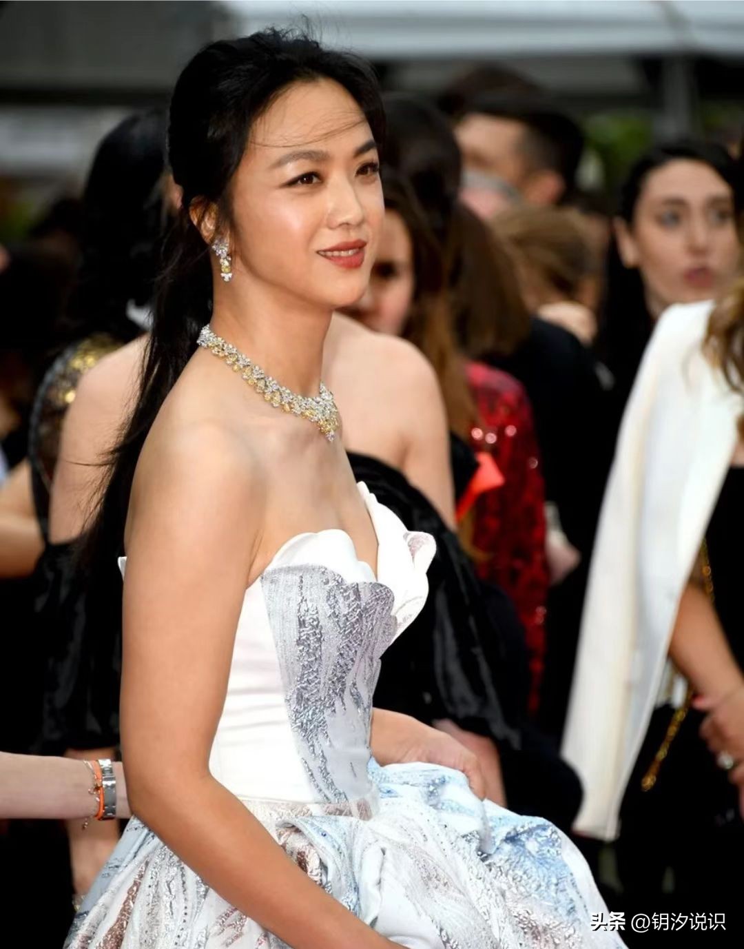 Tang Wei at the Cannes Film Festival, wearing a silver skirt and silver ...