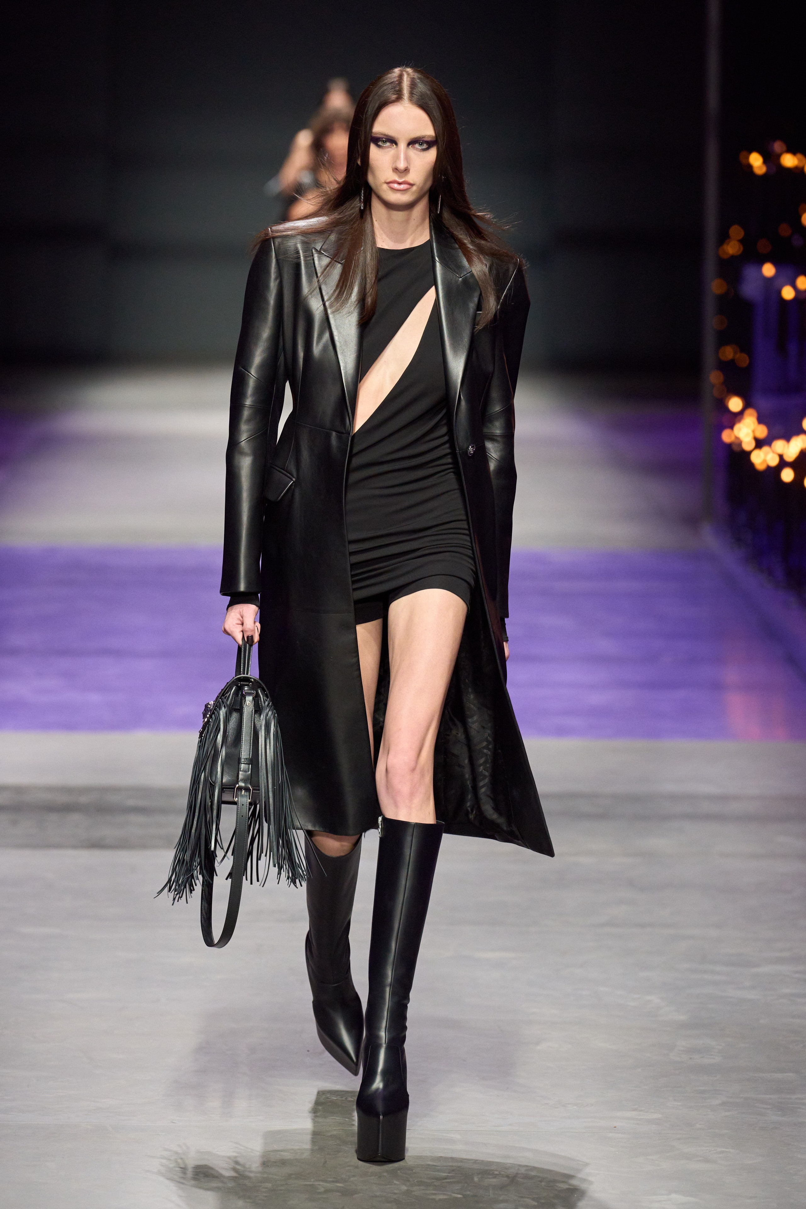 Versace's Spring/Summer 2025 collection presents a fashion show that