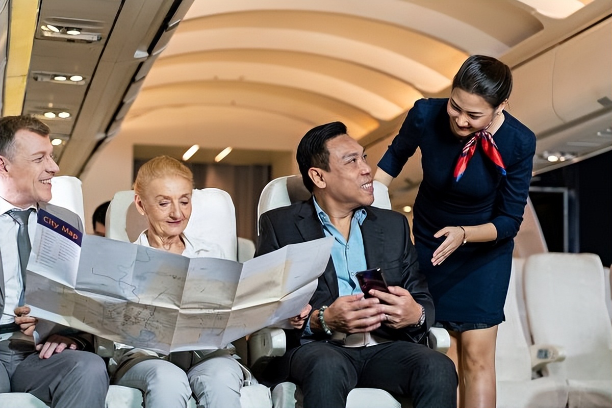 Why do flight attendants stand at the entrance of the cabin when