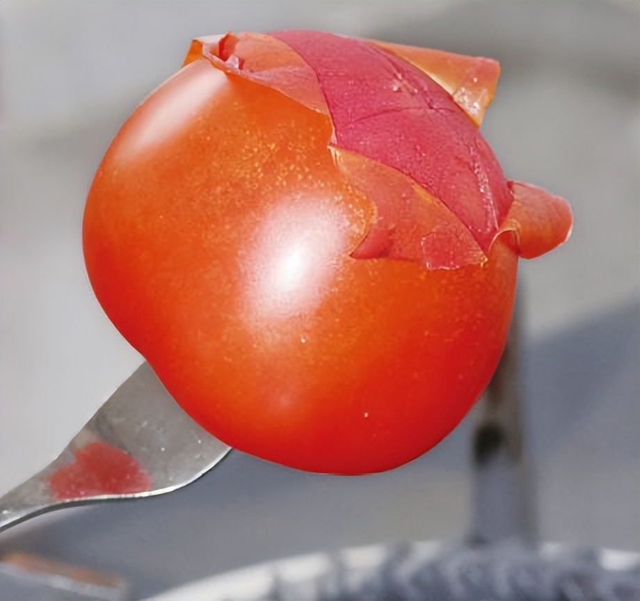Stop scalding tomatoes with boiling water, use a fork to finish it in