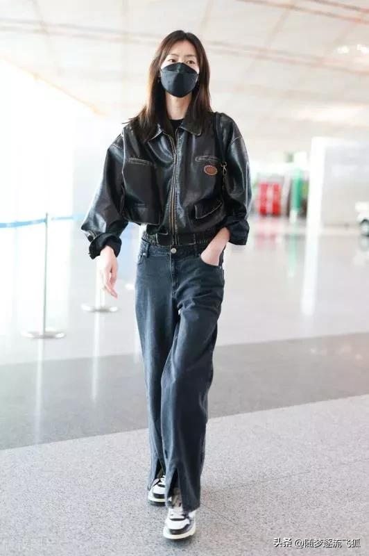 Liu Wen is wearing a black leather jacket + slit jeans + sneakers with ...