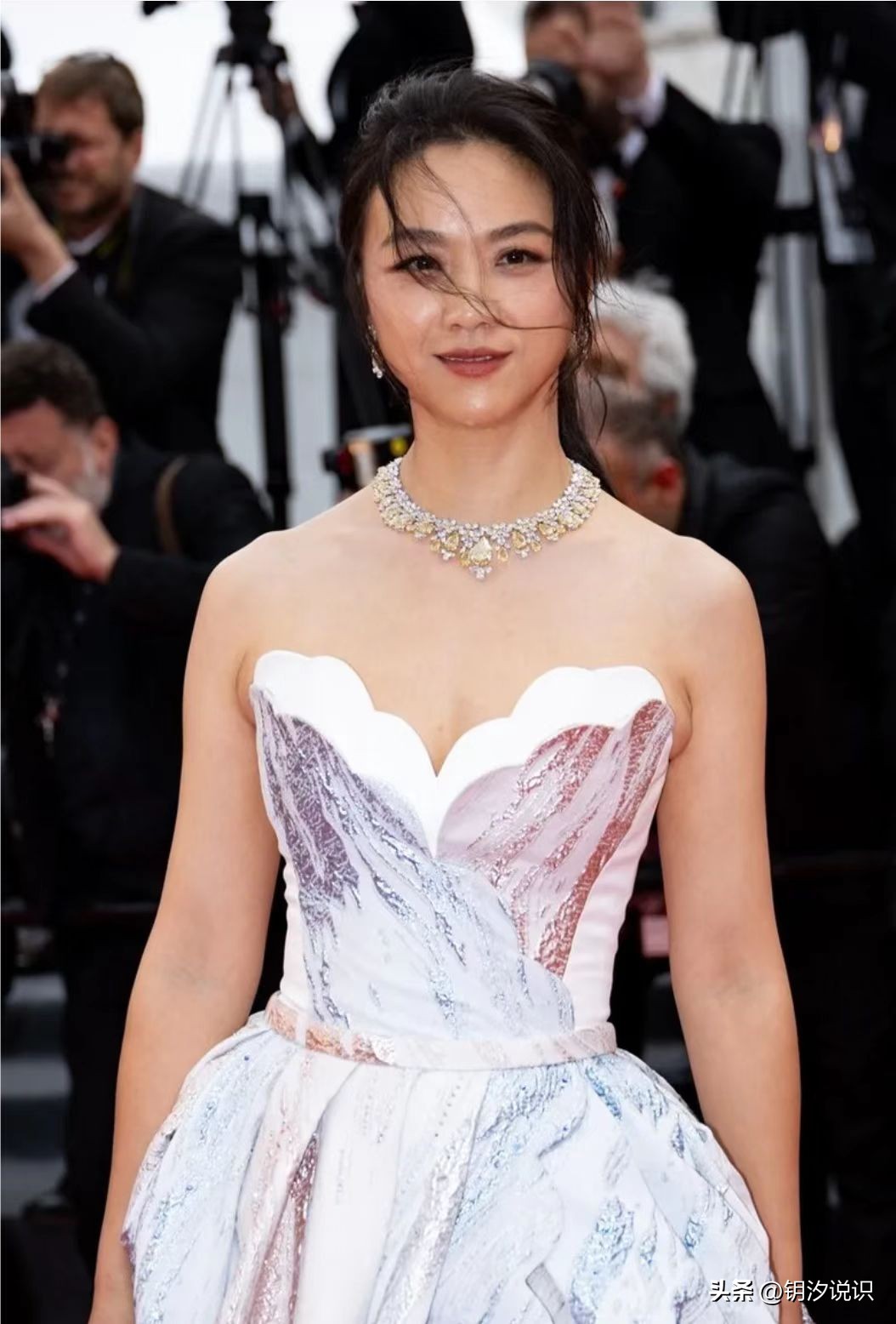 Tang Wei at the Cannes Film Festival, wearing a silver skirt and silver ...