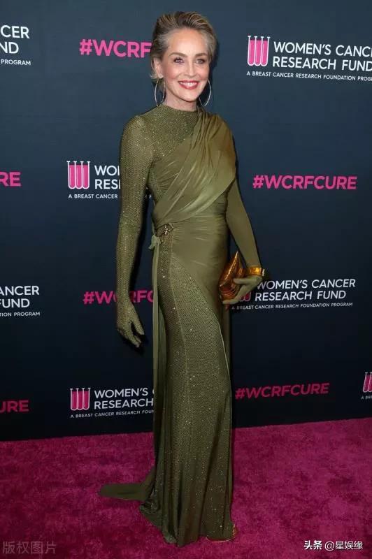 Sharon Stone is wearing a dark green bodysuit + high fashion clutch ...