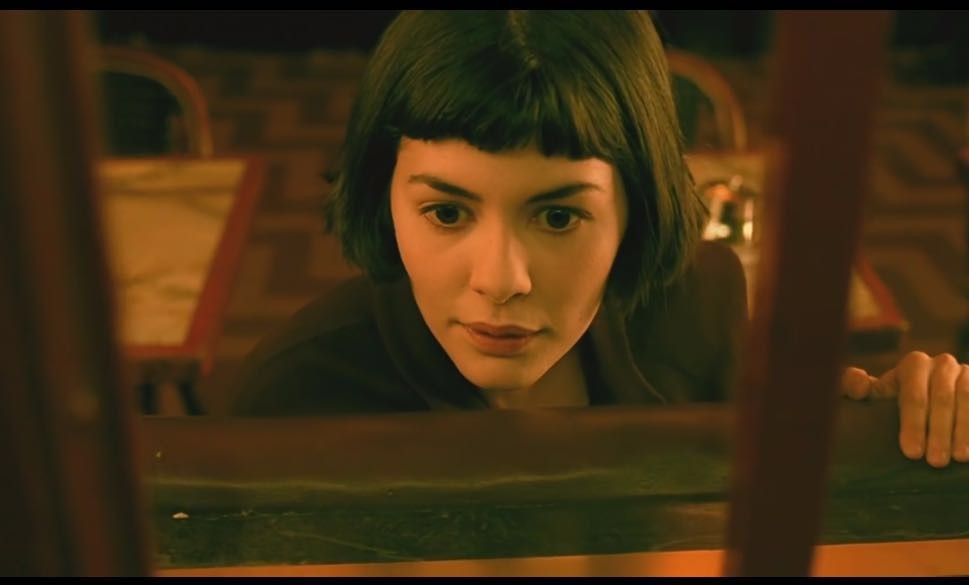 How does Amélie differ in its analysis of love, destiny, and
