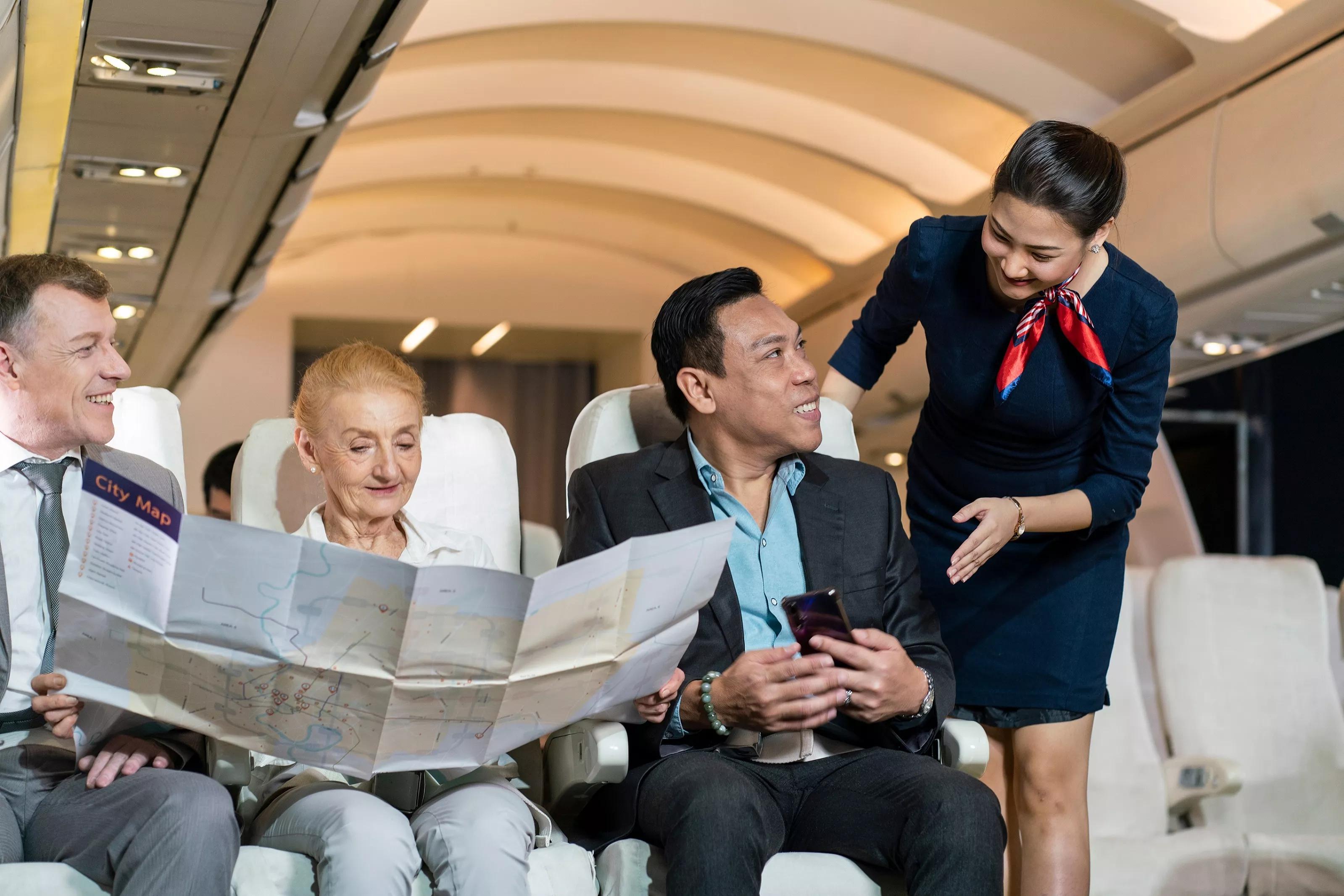 Why do flight attendants stand at the entrance of the cabin when